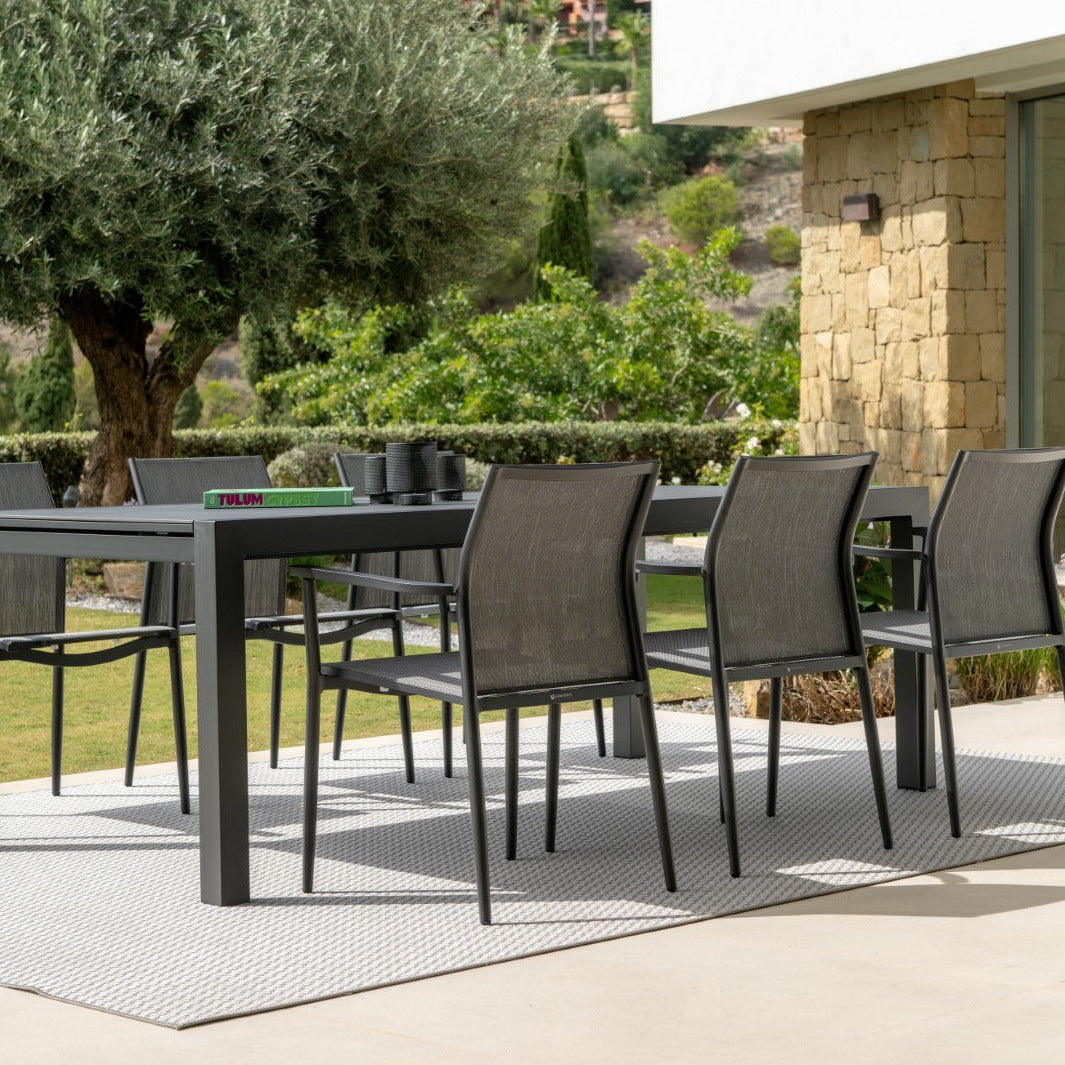 Livorno extendable garden table with all-ceramic table top 220-330x106 and Loya stacking chair in charcoal mat