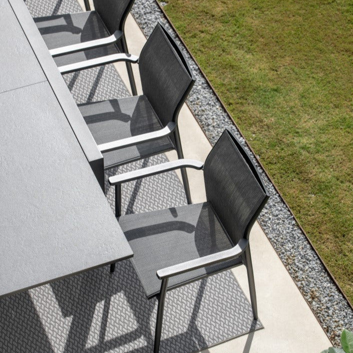 Livorno extendable garden table with all-ceramic table top 220-330x106 and Loya stacking chair in charcoal mat