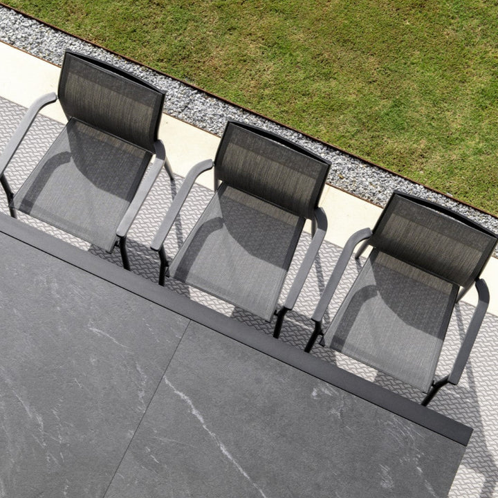 Livorno extendable garden table with all-ceramic table top 220-330x106 and Loya stacking chair in charcoal mat